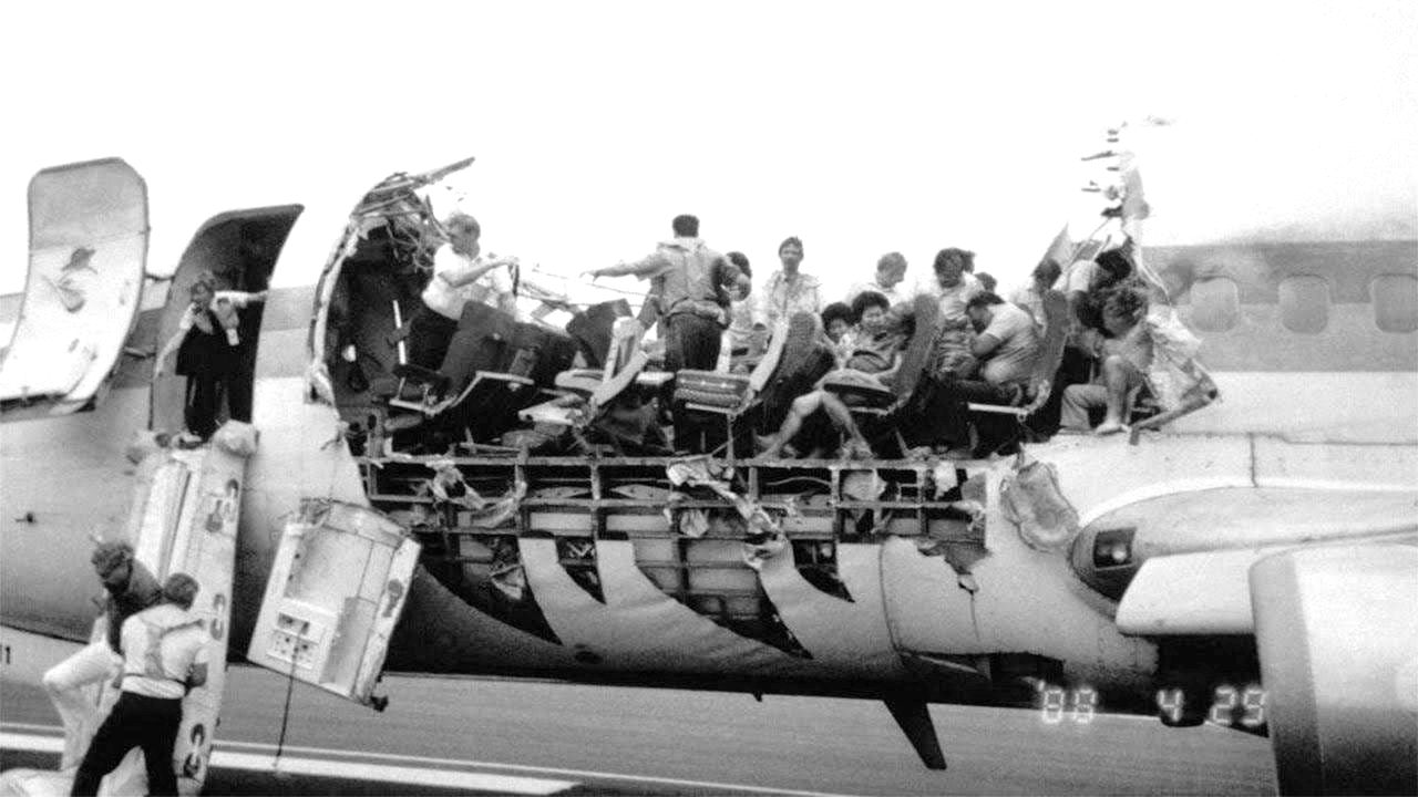 A photograph of Aloha Airlines Flight 243 showing severe fuselage damage caused by explosive decompression during the flight. The incident underscored significant gaps in aircraft maintenance practices, including the necessity for effective Corrosion Prevention and Control Programs (CPCP) and guidelines to prevent Widespread Fatigue Damage (WFD).